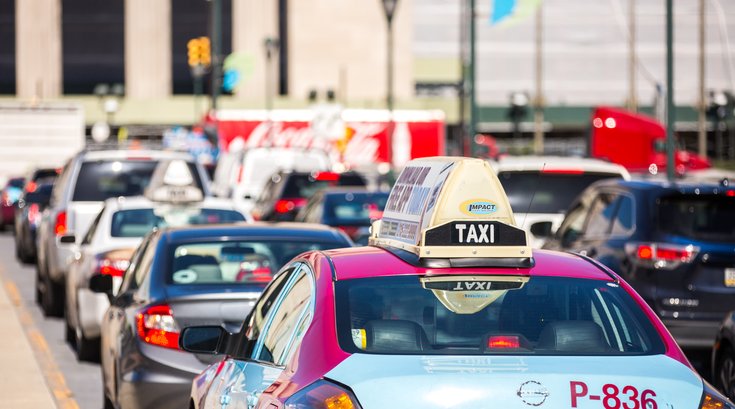 Freedom Taxi in traffic near 30th Street Station