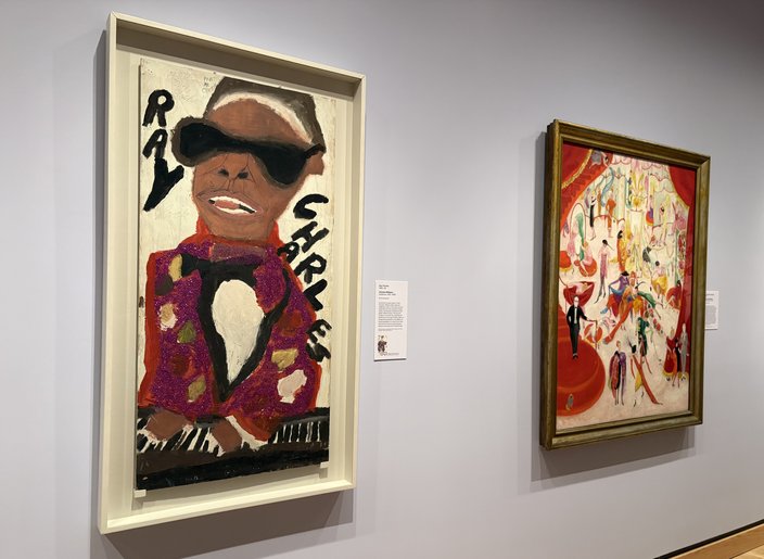 A portrait of Ray Charles and another painting of Bendel's department store hang on a gallery wall inside the Philadelphia Museum of Art
