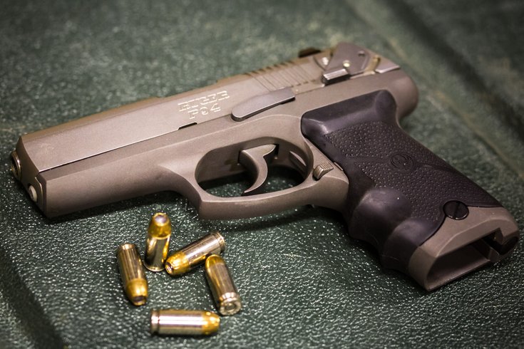 Stock_Carroll - Handgun with Bullets