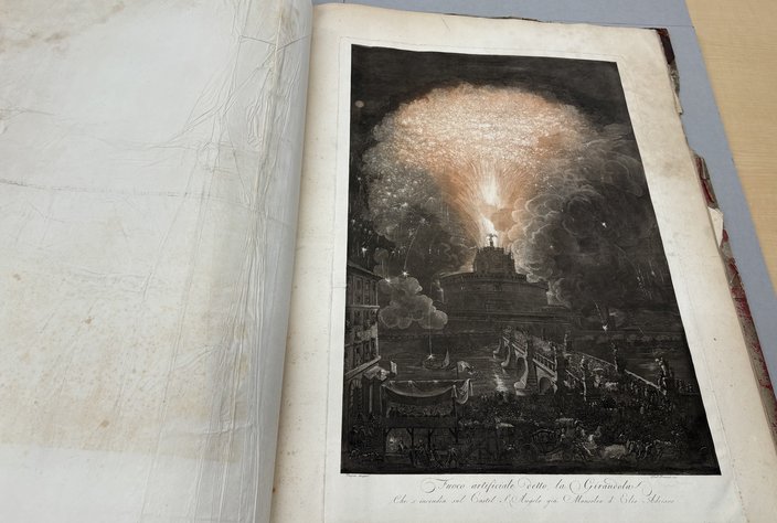 Color print of a fireworks display in a bound book