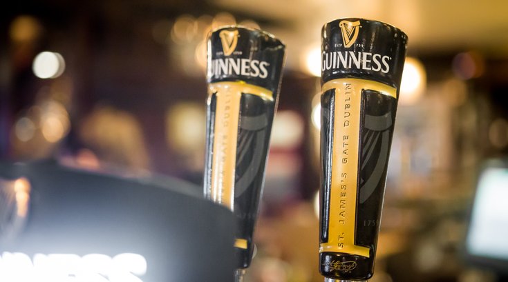 Stock_Carroll - Guinness beer taps at Fado Irish Pub