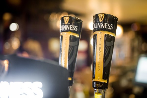 Stock_Carroll - Guinness beer taps at Fado Irish Pub
