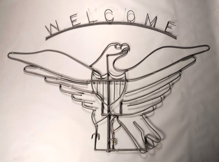 Iron shaped like an eagle with the text 'welcome'