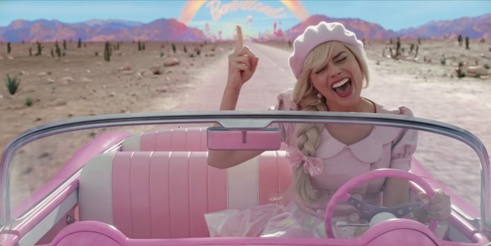 Margot Robbie sings and drives a pink car in 