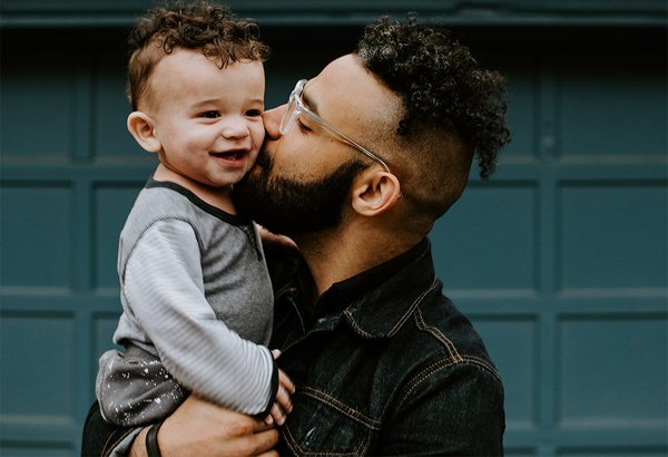 Man Holds Child 08032019