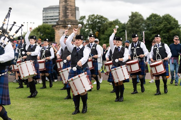 The drum corps of the Ulster Scottish Pipe Band performs at the World Pipe Band Championships