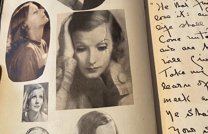 Cut-out photos of Greta Garbo pasted onto a page of Mercedes de Acosta's bible.