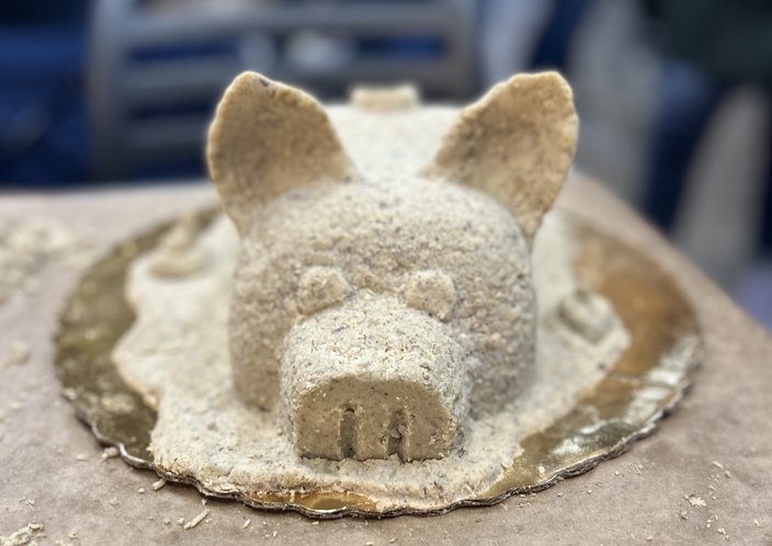 A sculpture of a piglet made from scrapple