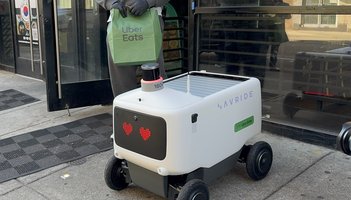 Woman blocks Uber robot