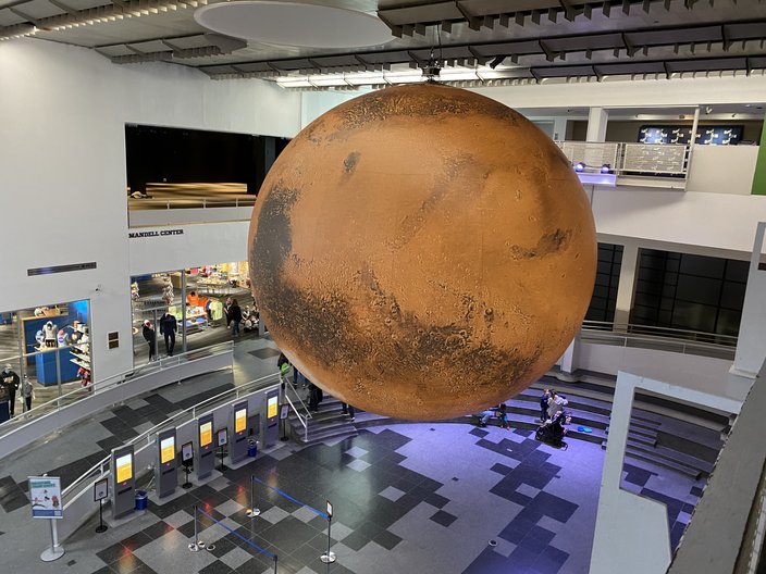 A sculpture of the planet Mars hanging over the atrium in the Franklin Institute
