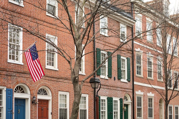 Carroll - An American flag hangs on a row house in Society Hill