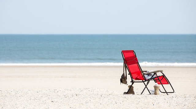 Beach chair along the shore