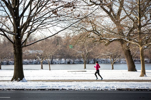 Woman running along river banks ibx rej