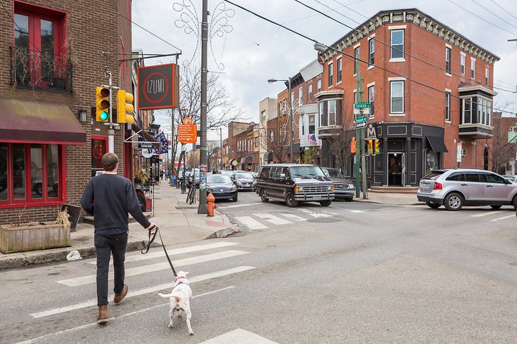 Man walking a dog in South Philly - Passyunk