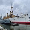 USS Olympia illuminated against the Delaware River