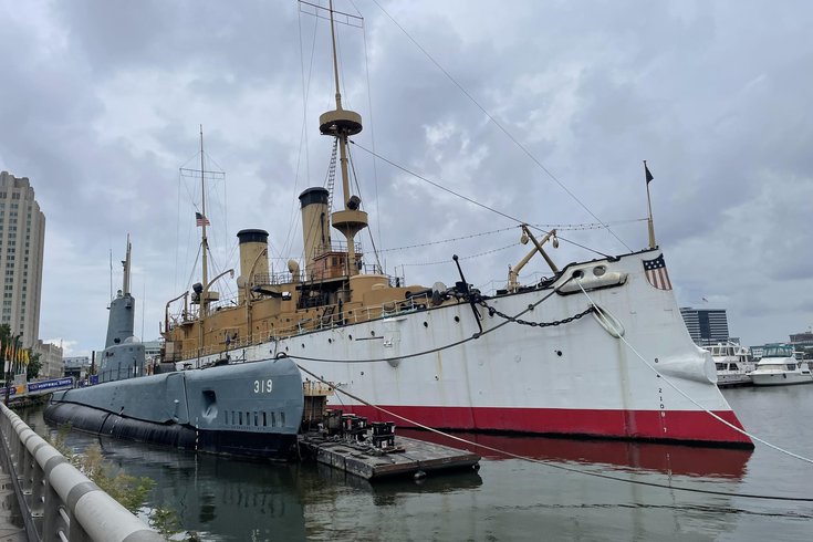 USS Olympia illuminated against the Delaware River