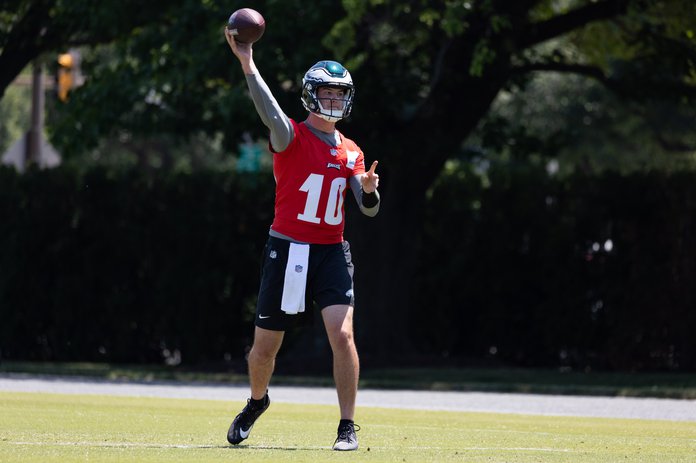 Philadelphia Eagles' Tanner McKee, left, talks to a member of the