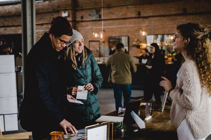 Philadelphia Wedding Walk - Attendees speaking with vendor