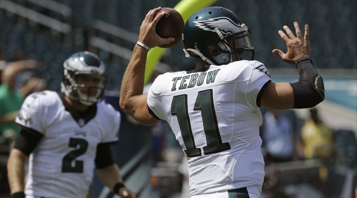 090315_Tebow-Barkley_AP