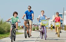 Limited - EssentiaSummer_1000x650_Bike_family on Bike Path_Crest2.jpg