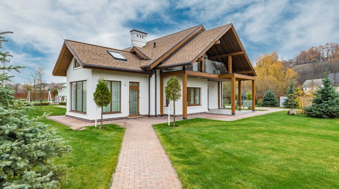 Modern home with brick patio and covered porch