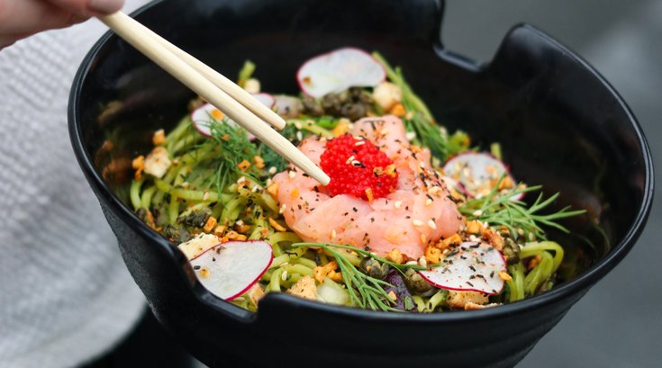 honeygrow and black seed bagel dish