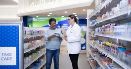 Limited - Rite Aid Pharmacist Helping Customer