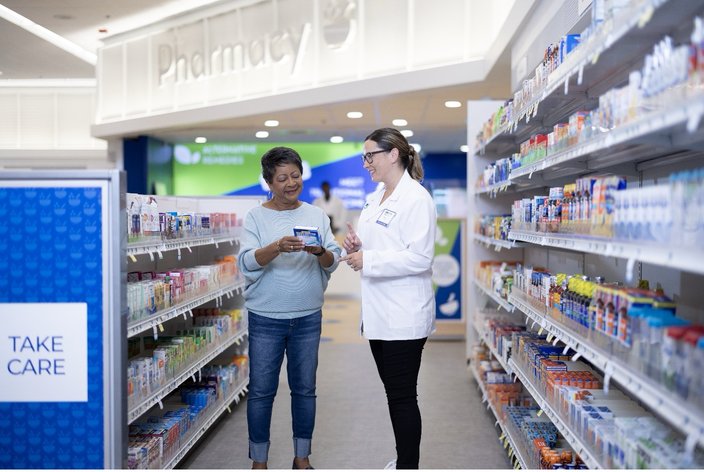 Limited - Rite Aid Pharmacist Helping Customer