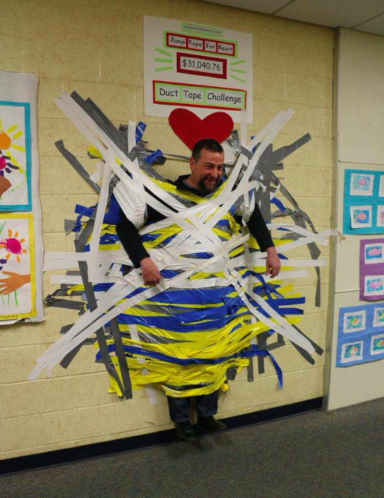 Turrill students tape principal, teachers to wall in fundraiser for new  books - Lapeer Area View