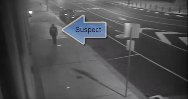 Security camera footage shows a man throwing an object at the District Attorney's Office, breaking the window. 