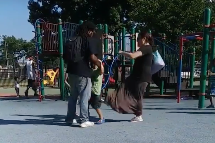 Woman kicking boy at Tacony Park