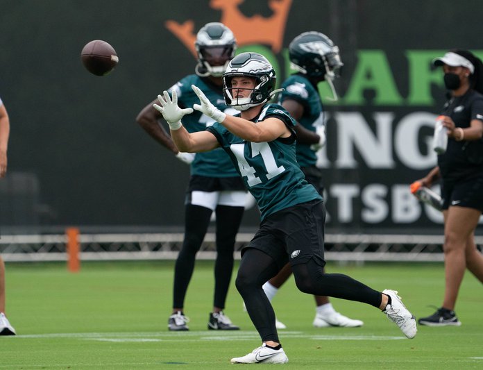 Philadelphia Eagles Alumni Willie Thomas, right, poses with a member of the  military before playing a game of flag football during practice at NFL football  team's training camp, Saturday, July 30, 2022