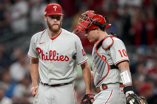 Guest manager Jimmy Rollins stuffs his belly to look like Tommy