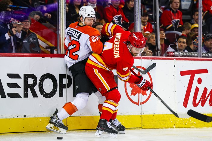 Christian-Dvorak-Board-Battle-Flyers-Flames-12.31.25-NHL.jpg
