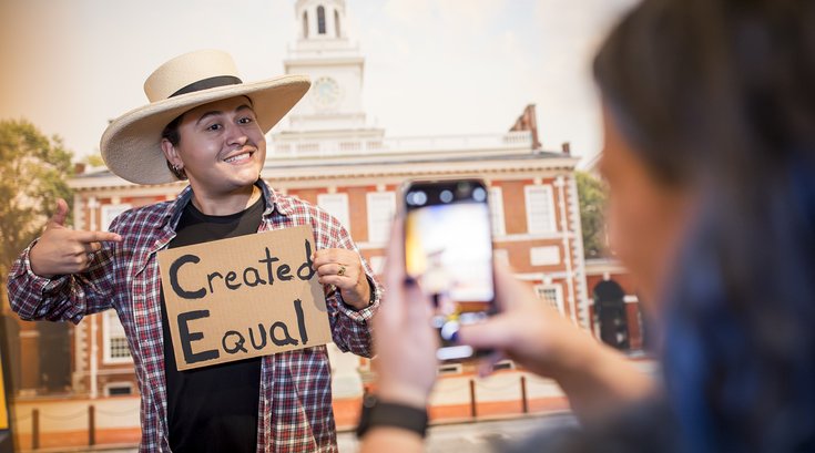 Visitor poses in The Declaration's Journey selfie station