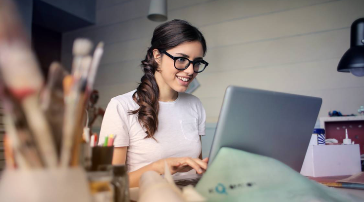 Woman working at desk being creative