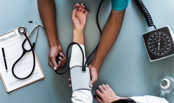 Doctor takes a patient's blood pressure
