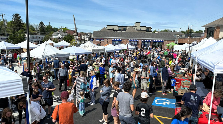 Shoppers browse the Berwyn Farmers Market in Berwyn