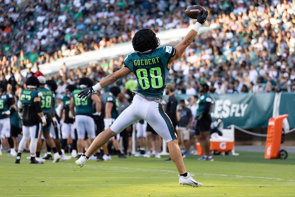 Philadelphia Eagles' Dallas Goedert, left, catches a pass in front