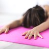 Woman meditating on a mat