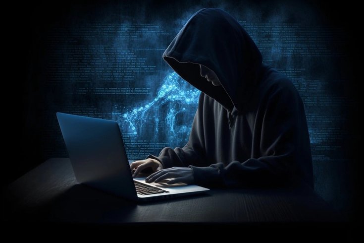 A visual of a hacker on a computer