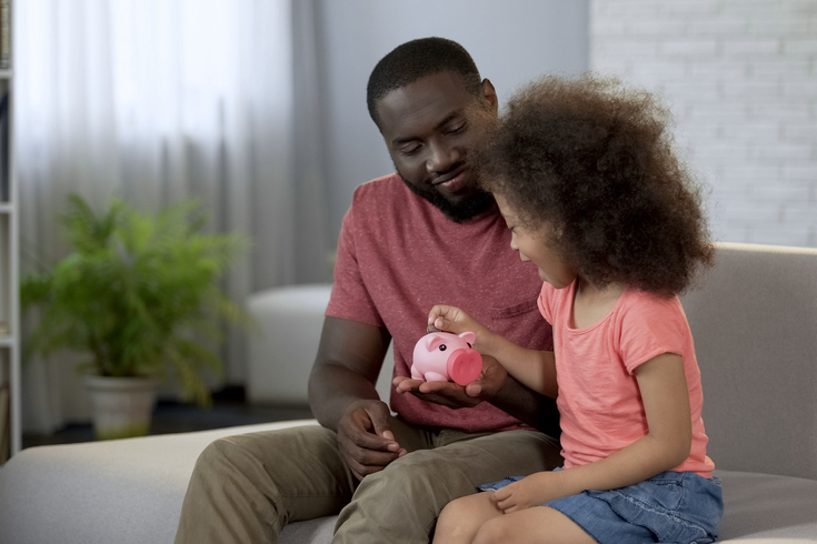 Purchased - A father teaching his daughter about finances