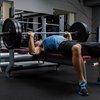 Man using a weight bench at gym