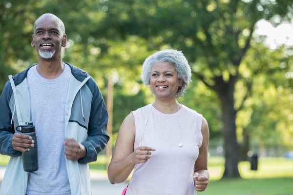 Purchased - Senior couple running together outside