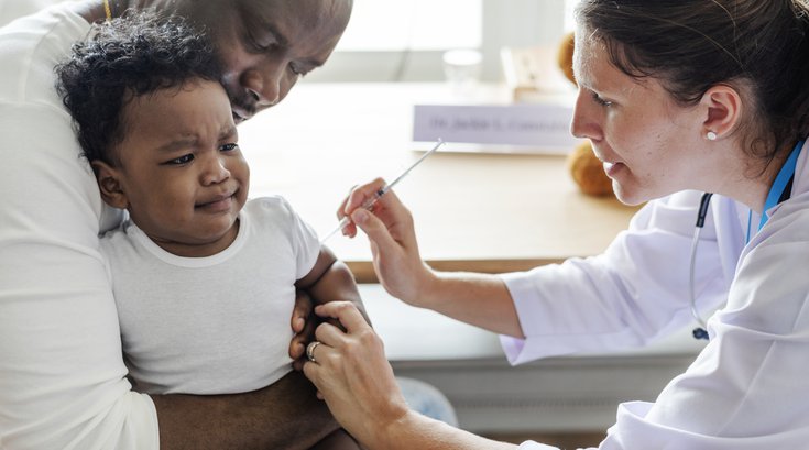 Purchased - Baby getting vaccinated by a doctor