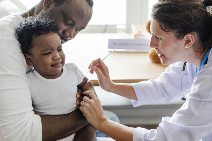 Purchased - Baby getting vaccinated by a doctor