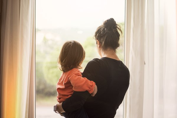 Purchased - Mother and son looking out window