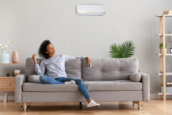 Purchased - relaxed woman sitting on couch breathing fresh air