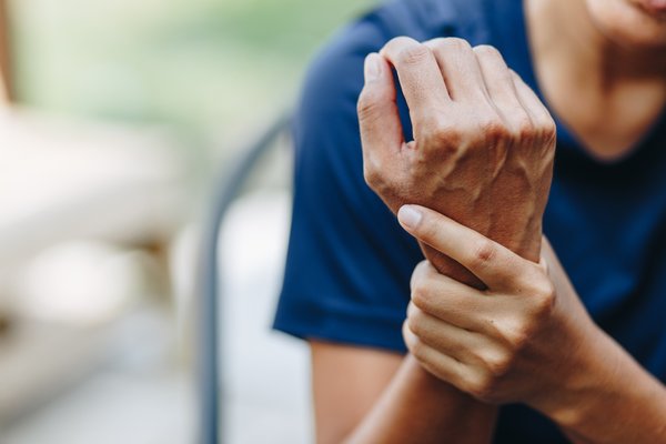 Young woman with pain in wrist