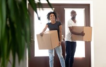 Purchased - Excited black couple impressed entering new home together